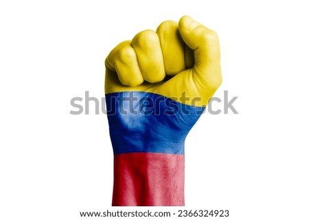 Man hand fist of COLOMBIA flag painted. Close-up