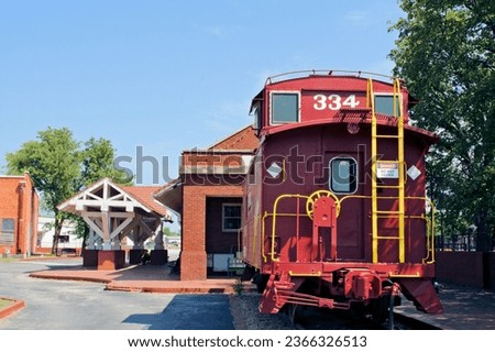 Red caboose at the Sante Fe railroad depot museum on Route 66 in downtown Bristow, Oklahoma. Royalty-Free Stock Photo #2366326513