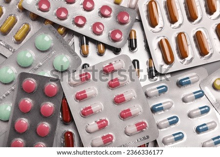Many blisters with different pills as background, top view Royalty-Free Stock Photo #2366336177