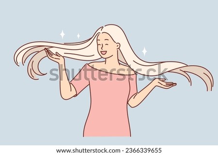 Happy blonde woman with long hair, shows new hairstyle and rejoices in shine and splendor of hairdo obtained thanks to quality shampoo. Girl in dress demonstrates stylish hairstyle and laughs Royalty-Free Stock Photo #2366339655
