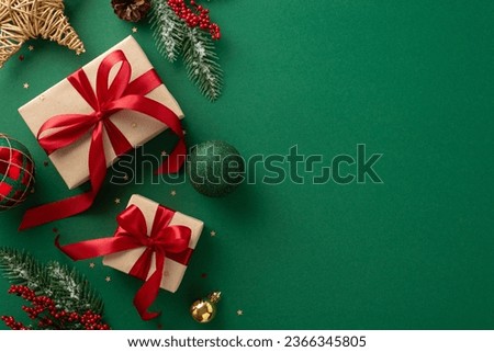 Season's greetings scene. Top-view of boxes tied with bows, Christmas decorations, balls, rustic star, holly berries, frosty spruce branches, confetti on green backdrop, perfect for messages or promo Royalty-Free Stock Photo #2366345805