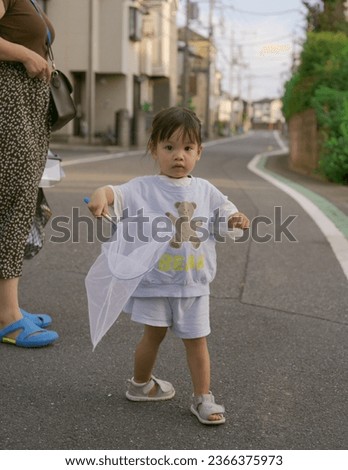 Little baby playing in the park on summer day in Japan