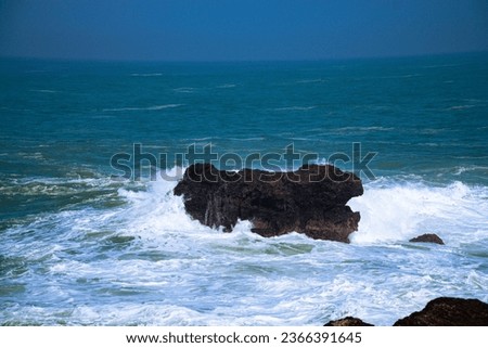 A panoramic view of rocky coastline hits by the wave. Menganti Beach, Indonesia