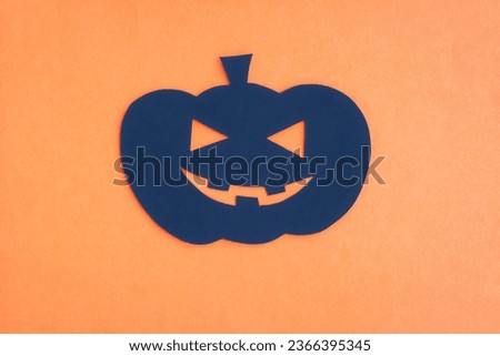 Happy Halloween, Pumpkin smile make from paper cut on orange background, Decorative Halloween concept