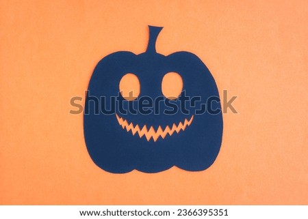 Happy Halloween, Pumpkin smile make from paper cut on orange background, Decorative Halloween concept