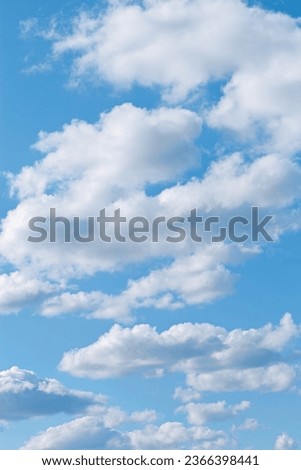 Blue sky with white clouds, tranquil blue trend color, pastel colored cloudscape. Fluffy heaven pattern. Beautiful Cloudy background, nature environment backdrop, wallpaper, phone screensaver