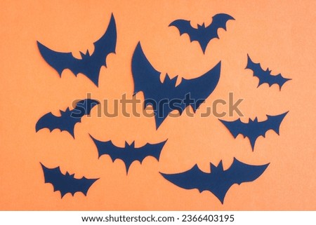 Happy Halloween, Bats flying make from paper cut on orange background, Decorative Halloween concept	