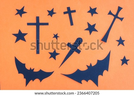 Happy Halloween, Bats flying , Black star and Christian cross make from paper cut on orange background, Decorative Halloween concept