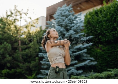 Beautiful diabetic woman preparing for outdoor run in the city. Royalty-Free Stock Photo #2366409329