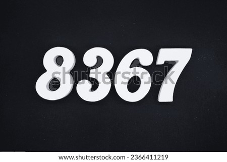 Black for the background. The number 8367 is made of white painted wood.