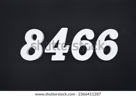 Black for the background. The number 8466 is made of white painted wood.