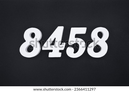Black for the background. The number 8458 is made of white painted wood.