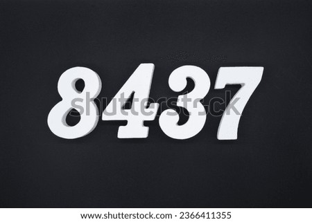 Black for the background. The number 8437 is made of white painted wood.