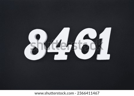 Black for the background. The number 8461 is made of white painted wood.