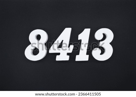 Black for the background. The number 8413 is made of white painted wood.