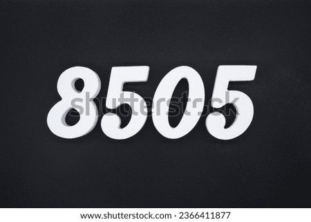 Black for the background. The number 8505 is made of white painted wood.