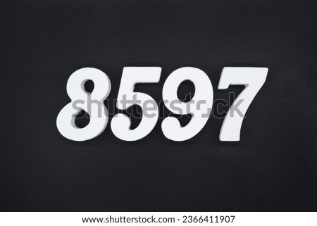Black for the background. The number 8597 is made of white painted wood.