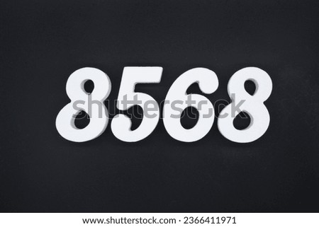 Black for the background. The number 8568 is made of white painted wood.