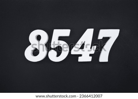 Black for the background. The number 8547 is made of white painted wood.