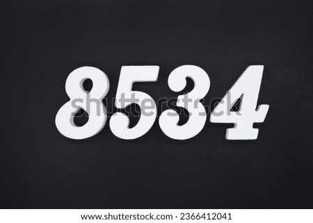 Black for the background. The number 8534 is made of white painted wood.