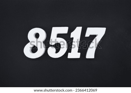 Black for the background. The number 8517 is made of white painted wood.