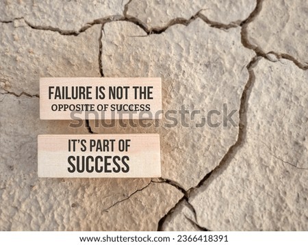 Inspirational motivational quote. Failure is not the opposite of success, it's part of success. Text on wooden blocks background.

