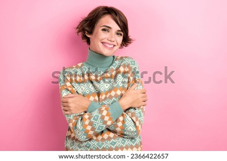 Photo of young girlfriend wear stylish winter season ugly sweater feel cozy cheerful cuddles herself isolated on pink color background