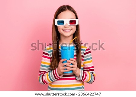 Photo of cute daughter small girl holding cup soda coca cola drinking unhealthy beverage watch 3d cinema isolated on pink color background