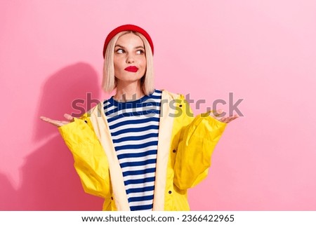 Photo of funny cute confused girl misunderstanding shrug shoulders no idea look empty space minded isolated on pink color background
