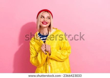 Photo of young model her yellow raincoat lovely look empty space spring season preparing buy light jacket isolated on pink color background