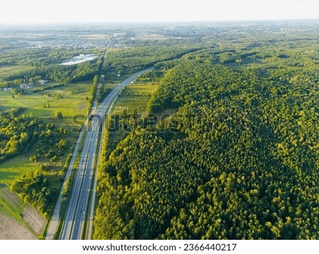 Białobrzegi, Polska, 09.24.2023, drone shot - S7 expressway, visible forest, fields, cars, gas station Royalty-Free Stock Photo #2366440217