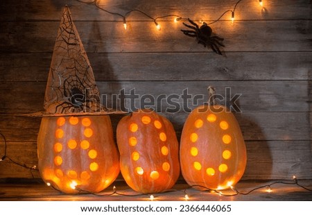 halloween pumpkins on old dark wooden background 