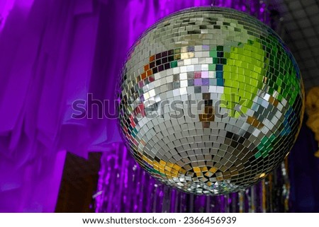 Disco ball on the purple background.