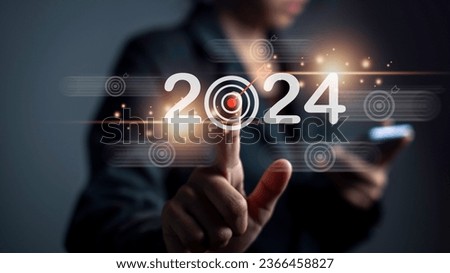 2024 target plan goal change from 2023 concept. Calendar change challenge myself increase performance action start 2024 business growth future. Businessman touch target 2024 target icon.