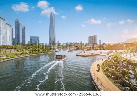 People are riding a tourist boat in summer of Korea at Central Park in Songdo District, Incheon South Korea. Royalty-Free Stock Photo #2366461363