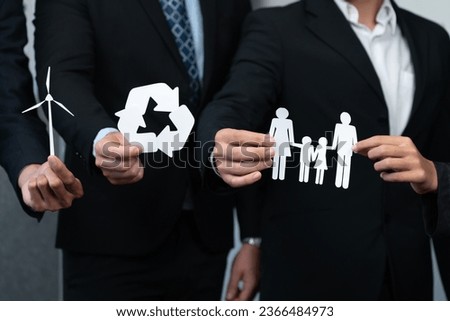 Business people holding eco-friendly and recycle icons as corporate responsibility for social and environment concept with waste management for greener community. Quaint