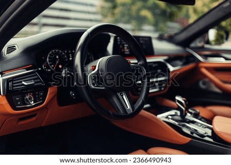 Modern supercar interior with leather panel, sport seats, multimedia and digital dashboard Royalty-Free Stock Photo #2366490943