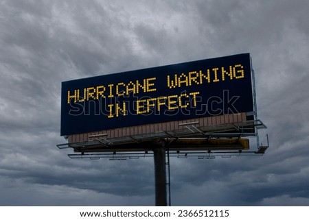 An electronic highway billboard with hurricane warning in effect message
