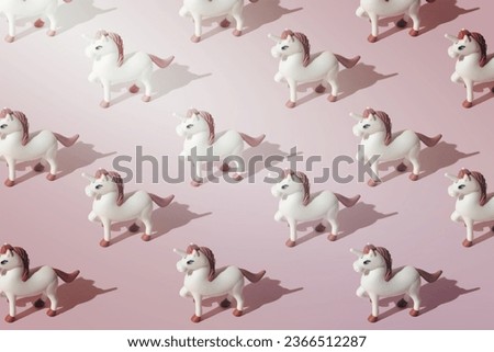 Simple and cute unicorn pattern. Pastel pink color tones. Minimal composition.