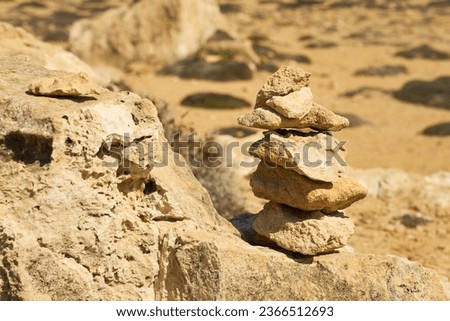 Stones stacked on top of each other with a blurred background