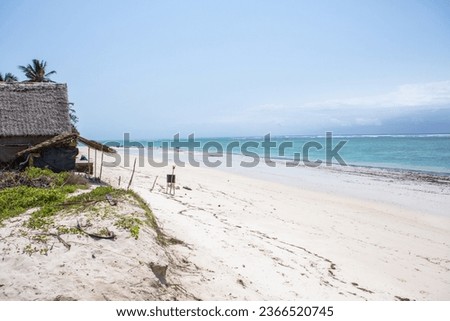 Paradise beach with white sand and palms. Diani Beach at Indian ocean surroundings of Mombasa, Kenya. Landscape photo exotic beach in Africa Royalty-Free Stock Photo #2366520745