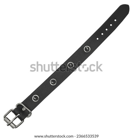 Black leather bracelet with spikes, holnitenes. An accessory for rockers, bikers, metalheads, goths and punks. Steampunk style. Close-up subject photography. Royalty-Free Stock Photo #2366533539