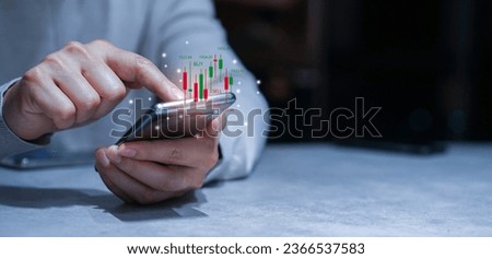 close up young investor man hand use smartphone to trade on stock market on exchange platform for currency exchange and global currency financial concept Royalty-Free Stock Photo #2366537583