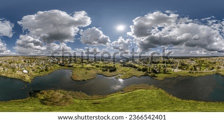 aerial full seamless spherical hdri 360 panorama view over the island and meandering river or lake with beautiful clouds in equirectangular projection, VR content  Royalty-Free Stock Photo #2366542401