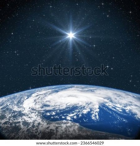 Bright star shines above the Earth in starry space. Birth of Jesus concept, Star of Bethlehem. Elements of this image furnished by NASA