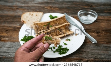 Hand hold bread with roasted marrow bones  fat Royalty-Free Stock Photo #2366548713