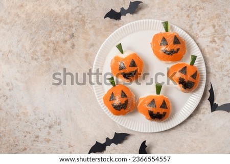 Funny Halloween Sushi Pumpkins Jack o Lantern, Sushi Monsters. Temari sushi, sushi balls. Healthy food for kids.