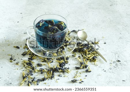 Blue tea on a light background. Organic blue tea Anchan, Clitoria. Butterfly pea flowers