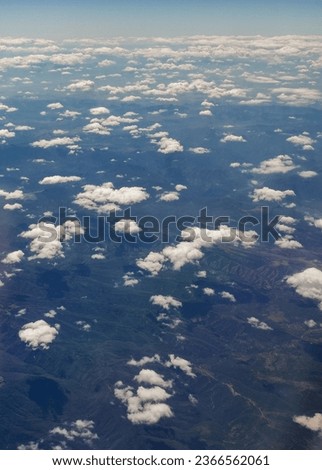 cloudscape from above. blue sky cumulus clouds. earth from above.