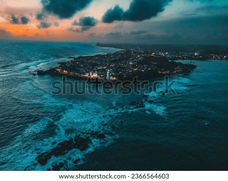 Aerial night view of the renowned Galle Fort, a historic fortress and iconic lighthouse landmark located in Galle, Sri Lanka, Asia. Ideal for travel and historical themes, landscape Royalty-Free Stock Photo #2366564603